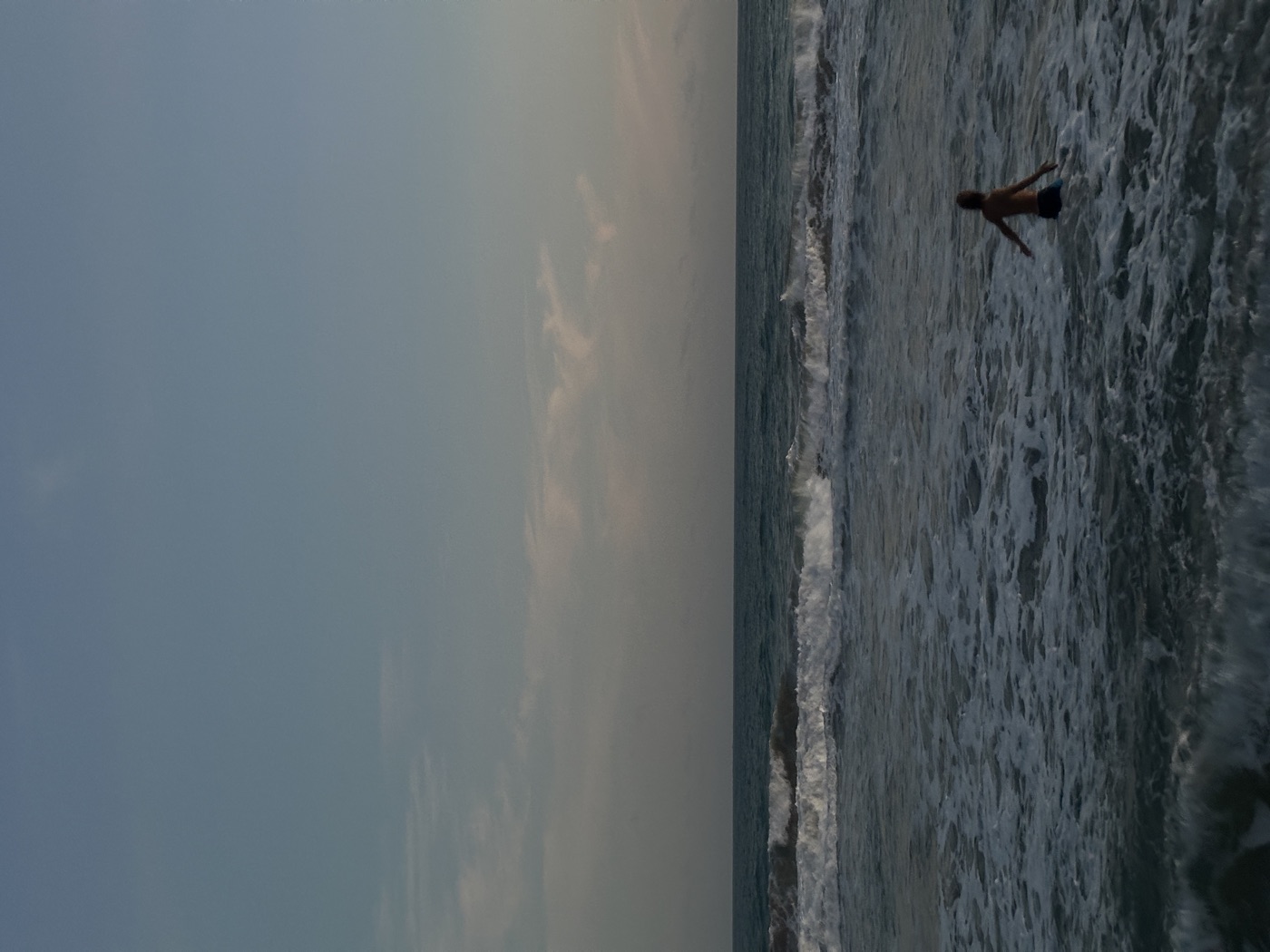 Swimming in the ocean at dusk